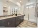 Elegant bathroom with double vanity, large mirror, and a frameless shower at 1431 W J Waltz Way, Apache Junction, AZ 85120