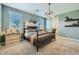 Main bedroom with a dark wood bed frame and neutral color palette at 1431 W J Waltz Way, Apache Junction, AZ 85120