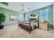 Main bedroom with a dark wood bed frame and neutral color palette at 1431 W J Waltz Way, Apache Junction, AZ 85120