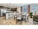 Modern kitchen featuring dark cabinetry, stainless steel appliances, and an island with seating at 1431 W J Waltz Way, Apache Junction, AZ 85120