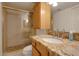 Clean bathroom with granite countertops and a walk-in shower at 14840 N 21St St, Phoenix, AZ 85022