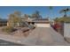 Exterior view of the house, showcasing its front yard and landscaping at 14840 N 21St St, Phoenix, AZ 85022