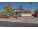 House exterior featuring a driveway and solar panels at 14840 N 21St St, Phoenix, AZ 85022