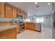 Modern kitchen featuring granite countertops and wood cabinets at 14840 N 21St St, Phoenix, AZ 85022