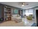 Living room featuring built-in shelving and a comfortable seating area at 14840 N 21St St, Phoenix, AZ 85022