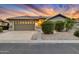 Single-story home with a two-car garage and landscaped front yard at 14861 W Verde Ln, Goodyear, AZ 85395