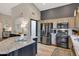 Spacious kitchen featuring granite countertops and stainless steel appliances at 14861 W Verde Ln, Goodyear, AZ 85395