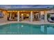 Expansive pool and patio area with ample seating and lighting at 14861 W Verde Ln, Goodyear, AZ 85395