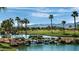 Peaceful water feature with waterfall and lush landscaping at 14861 W Verde Ln, Goodyear, AZ 85395