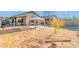 Large backyard with gravel and a gazebo at 15268 W Melissa Ln, Surprise, AZ 85374