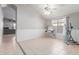 Bright dining room with tile floors and a view into the living room at 15268 W Melissa Ln, Surprise, AZ 85374