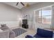 Living room with tiled floors, neutral walls and a comfy couch at 15268 W Melissa Ln, Surprise, AZ 85374