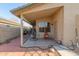 Covered patio with seating area and string lights at 15268 W Melissa Ln, Surprise, AZ 85374