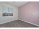 Simple bedroom with geometric accent wall and neutral decor at 16351 W Yucatan Dr, Surprise, AZ 85388