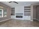 Living room features a modern fireplace and built-in shelving at 16351 W Yucatan Dr, Surprise, AZ 85388