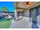 Covered patio with paver stones, Ornate door, and ceiling fan at 16351 W Yucatan Dr, Surprise, AZ 85388