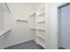 Spacious walk-in closet with ample shelving and hanging space at 16351 W Yucatan Dr, Surprise, AZ 85388