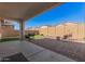 Spacious backyard with artificial turf and brick pavers at 17022 W Echo Ln, Waddell, AZ 85355