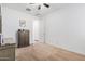 Bedroom with gray dresser and an interior door at 17022 W Echo Ln, Waddell, AZ 85355