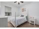 Charming bedroom with white bed frame and window blinds at 17022 W Echo Ln, Waddell, AZ 85355