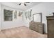 Bedroom with gray dresser and a window with blinds at 17022 W Echo Ln, Waddell, AZ 85355