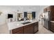 Kitchen island with white quartz countertop and stainless steel sink at 17022 W Echo Ln, Waddell, AZ 85355