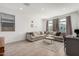 Spacious living room with neutral color palette and large windows at 17022 W Echo Ln, Waddell, AZ 85355