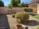 Landscaped backyard with gravel and decorative features at 17449 N Fairway Dr, Surprise, AZ 85374