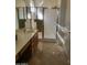 Clean bathroom with a vanity, shower, and tiled floor at 17449 N Fairway Dr, Surprise, AZ 85374