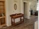 Entryway with wood flooring, console table, and view into adjacent room at 17449 N Fairway Dr, Surprise, AZ 85374