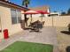 Patio with seating area and two umbrellas at 17449 N Fairway Dr, Surprise, AZ 85374