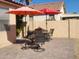 Patio with seating area and two umbrellas at 17449 N Fairway Dr, Surprise, AZ 85374