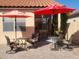 Spacious patio with two tables and umbrellas at 17449 N Fairway Dr, Surprise, AZ 85374