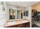 Double vanity bathroom with a large mirror and adjacent closet at 1865 W Keating Ave, Mesa, AZ 85202