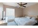 Bedroom with large bed, wood headboard, and neutral color scheme at 1865 W Keating Ave, Mesa, AZ 85202