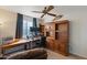 Home office with wooden desk, chair, and built-in shelving at 1865 W Keating Ave, Mesa, AZ 85202