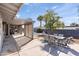 Covered patio with outdoor dining set and pool access at 1865 W Keating Ave, Mesa, AZ 85202