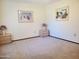 Bedroom with two nightstands and wall art at 19002 N Signal Butte Cir, Sun City, AZ 85373