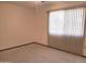 Spacious bedroom with large window and carpet at 19002 N Signal Butte Cir, Sun City, AZ 85373