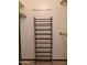 Image shows a closet with a shoe rack and hanging rods at 19002 N Signal Butte Cir, Sun City, AZ 85373