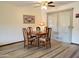 Dining area with a wooden table and four chairs at 19002 N Signal Butte Cir, Sun City, AZ 85373