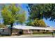 Beautiful single story home featuring solar panels and mature shade trees at 19002 N Signal Butte Cir, Sun City, AZ 85373