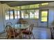 Sunroom with glass walls, tiled floor, and outdoor view at 19002 N Signal Butte Cir, Sun City, AZ 85373