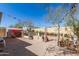 Shot of backyard featuring a shed and a play structure, with stone slab flooring and landscaping at 19308 W Jefferson St, Buckeye, AZ 85326