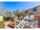 Backyard featuring landscaping, a small pergola, and a structure with stairs at 19308 W Jefferson St, Buckeye, AZ 85326