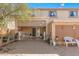 A backyard with a covered patio, concrete slab, string lights, and a neutral color scheme at 19308 W Jefferson St, Buckeye, AZ 85326