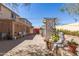 Backyard patio with shade and a statue in a well-maintained yard and garden at 19308 W Jefferson St, Buckeye, AZ 85326