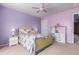 Bedroom featuring colorful walls and floral bedding at 19308 W Jefferson St, Buckeye, AZ 85326