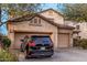 Charming two-story home with a three-car garage and a long concrete driveway at 19308 W Jefferson St, Buckeye, AZ 85326