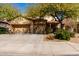 Inviting home featuring a three car garage and mature shade trees in a well kept front yard at 19308 W Jefferson St, Buckeye, AZ 85326